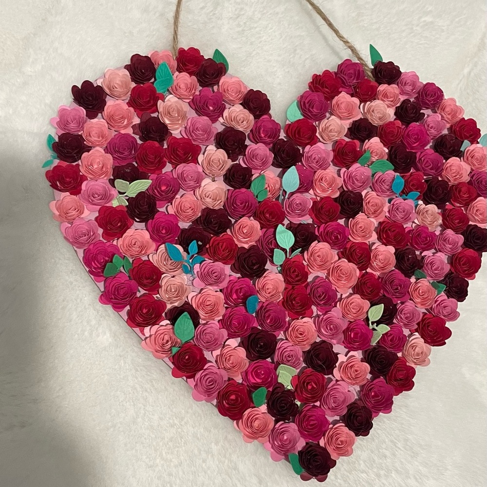 Paper flower heart hand crafted, miniature flowers with a gama of red color.
